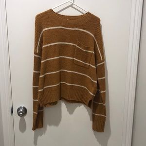 Mustard and white striped sweater.